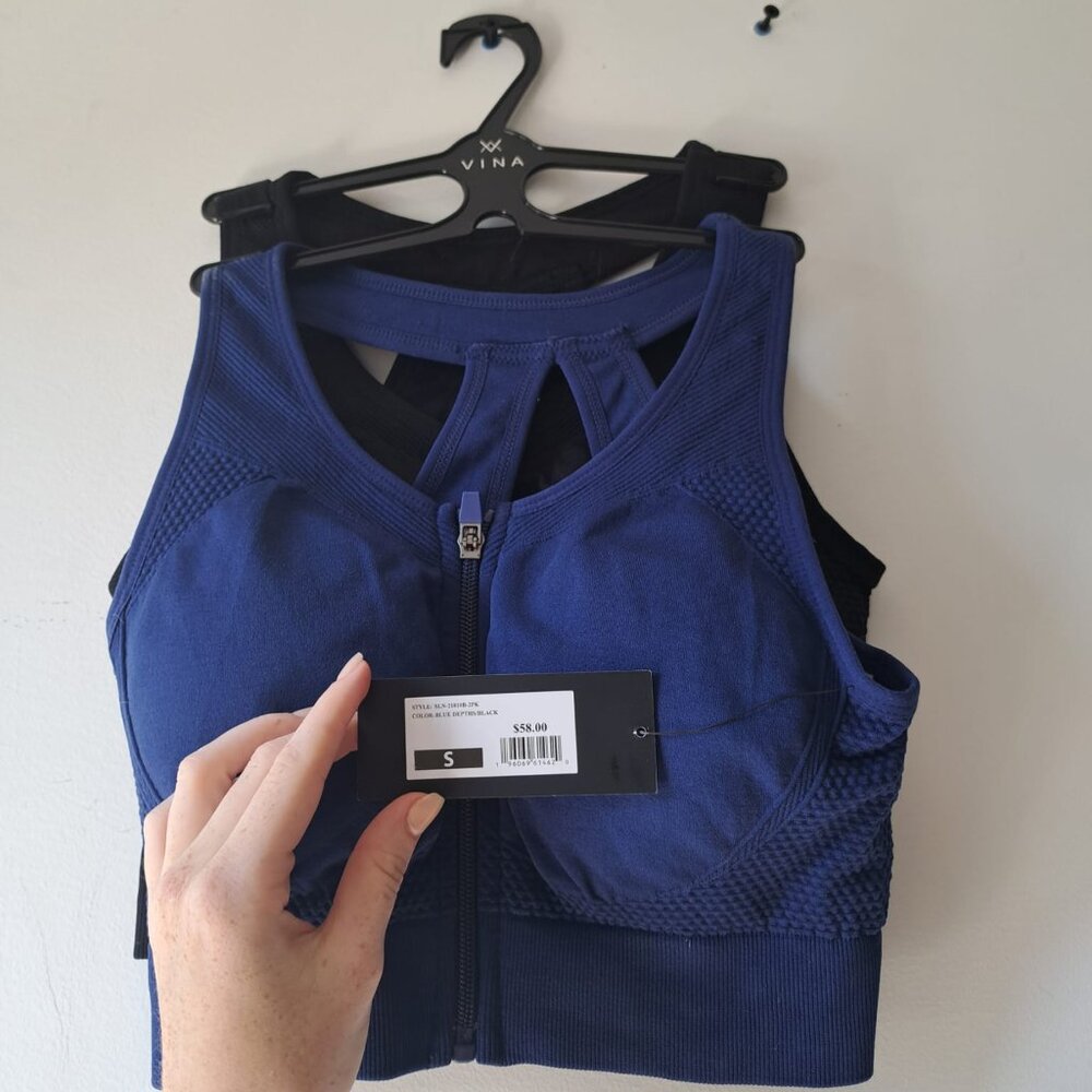 Set of two Sports bras from Vina! One dark blue, one black.